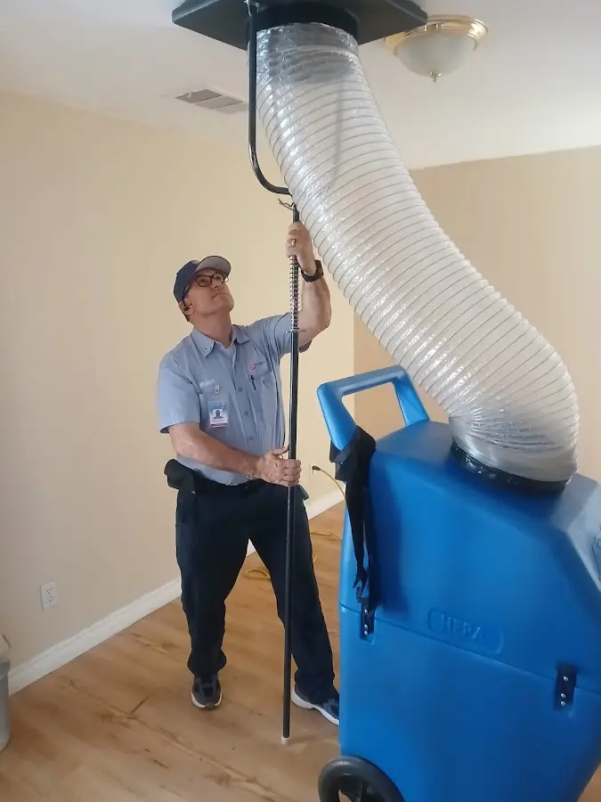 Furnace Tune-Up technician using HEPA equipment in Lincoln Park